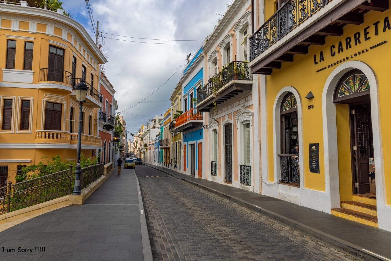 Cobblestone Street between Colorful Buildings in San Juan, Puerto Rico